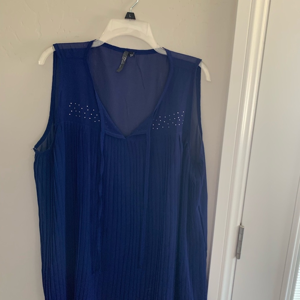 Beautiful sleeveless tunic with rhinestones on the